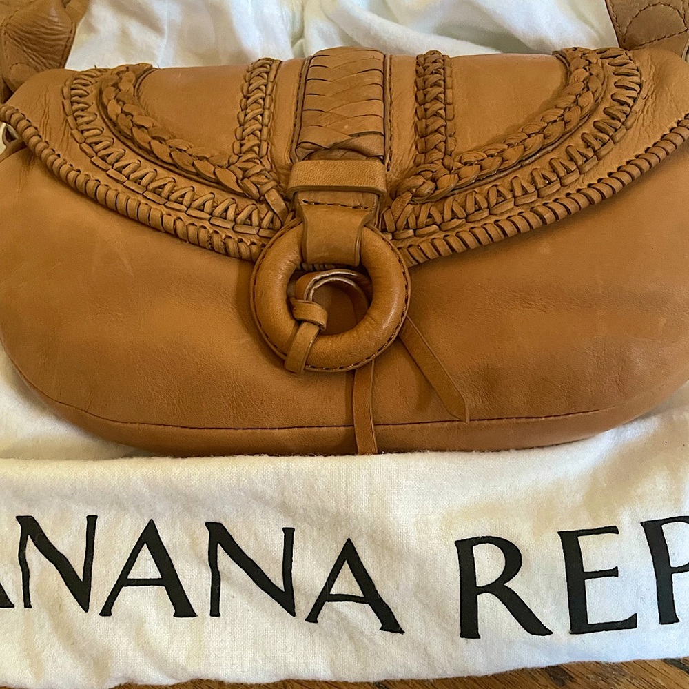 Brand new NEVER USED SOFT LEATHER PURSE. Half moon shape approximately 7 x 12